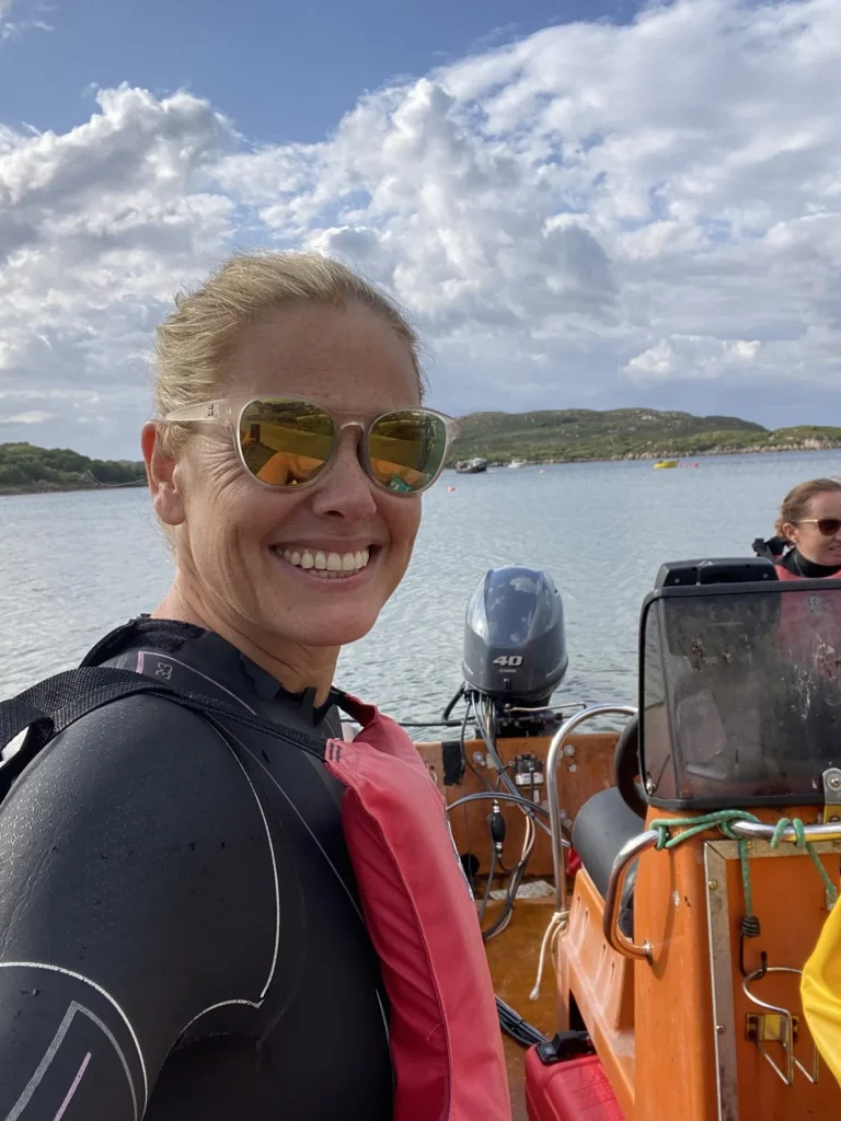Professional swimmer heading out to sea on a boat